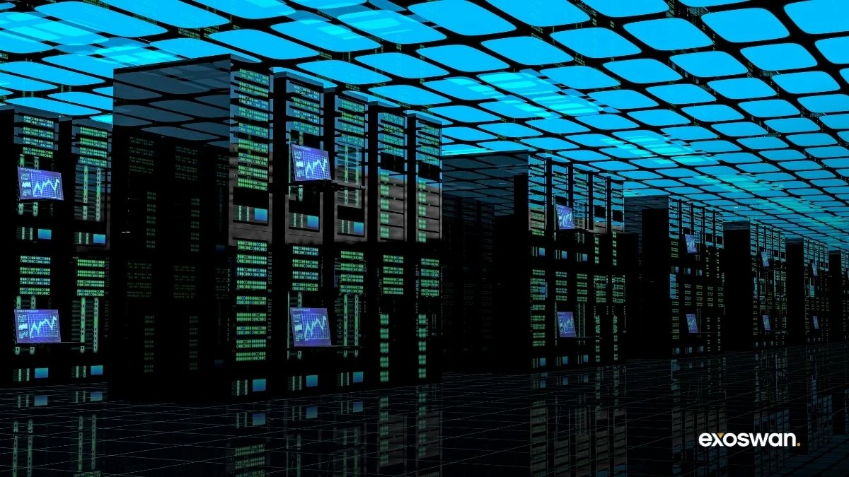 Rows of server cabinets beneath a bright cyan ceiling.