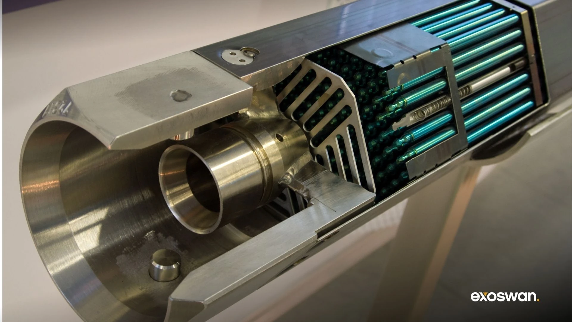 Metallic cutaway model showing a reactor component.