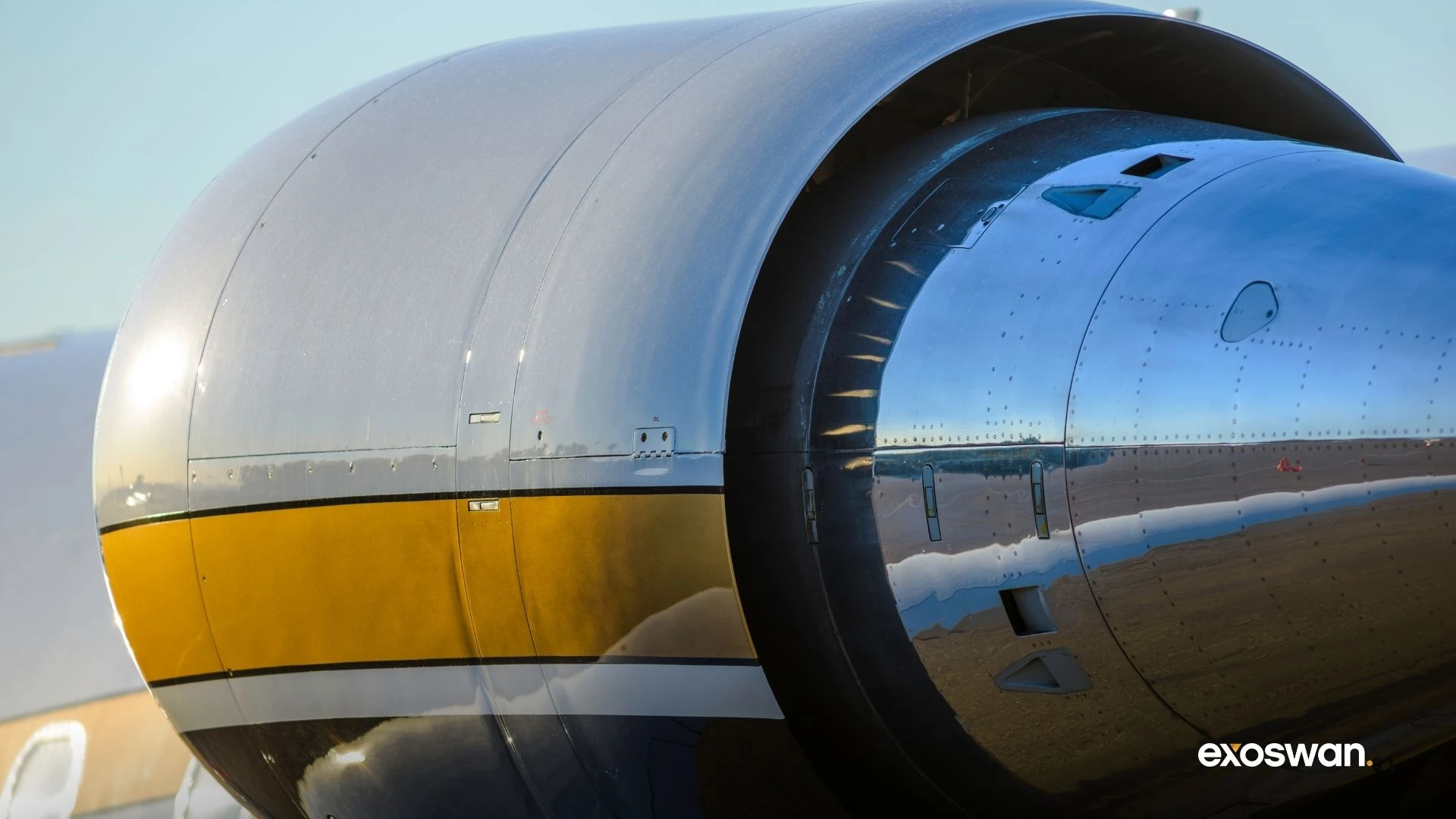 Close-up of a metallic aircraft engine nacelle.